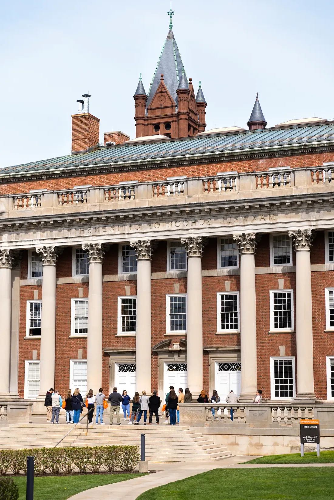 Students standing outside on a campus tour.