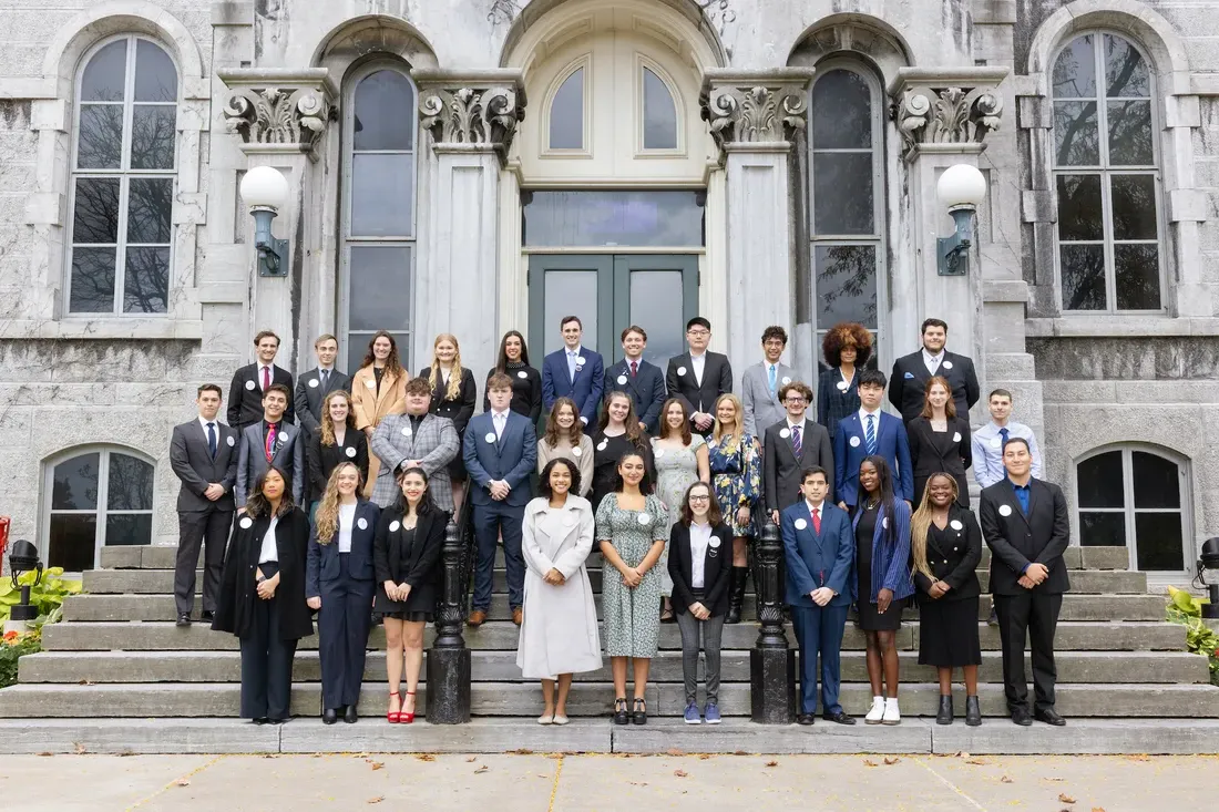 Remembrance scholars standing on steps.