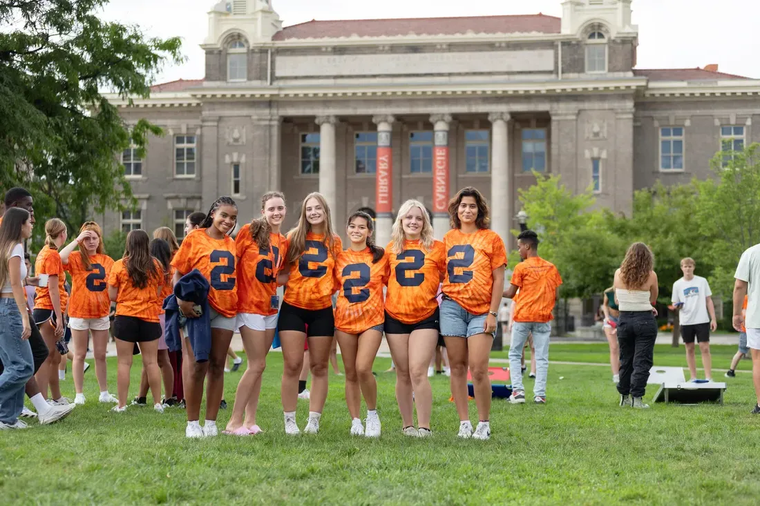 People wearing orange t-shirts.